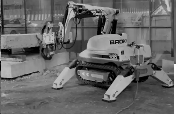 Robotic demolition machine Brokk 100 cutting concrete, showcasing advanced technology in construction by National Drilling Services.