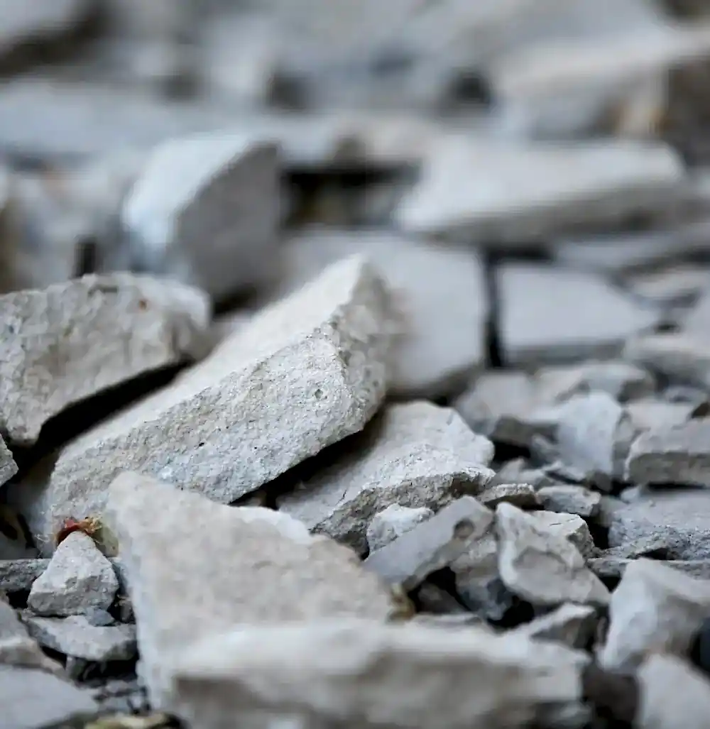 Concrete debris and fragments from controlled demolition, highlighting the clean and efficient results of concrete crunching services by National Drilling Services.
