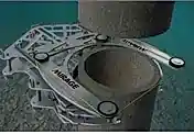 Diamond wire sawing equipment positioned for precise cutting of concrete in underwater construction settings.