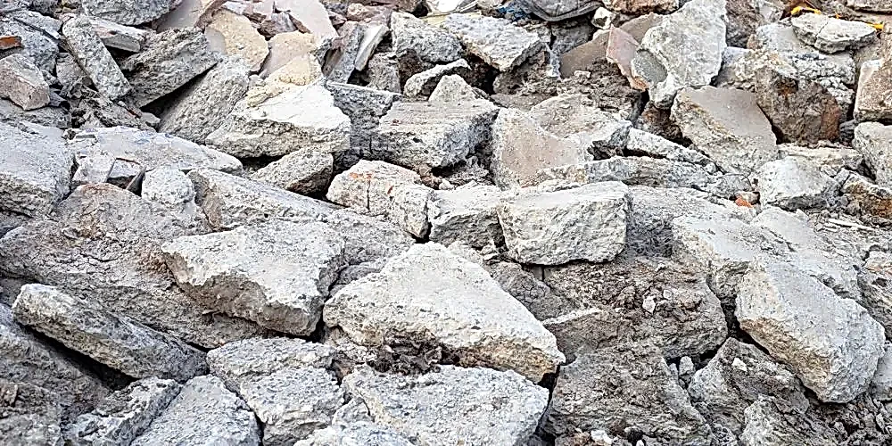 Concrete debris and rubble from demolition, illustrating the aftermath of construction work related to diamond core drilling services.
